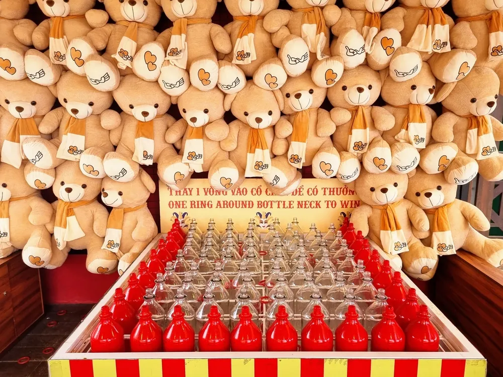 how carnival rides are freight shipped teddy bears hung above bottle carnival game