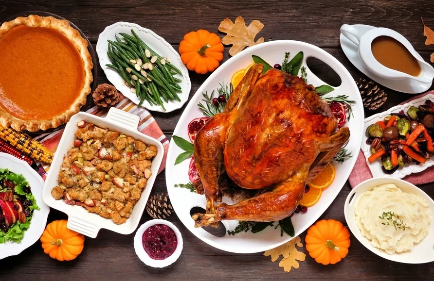 The Supply Chain Behind Thanksgiving Staples topdown view of a Thanksgiving dinner