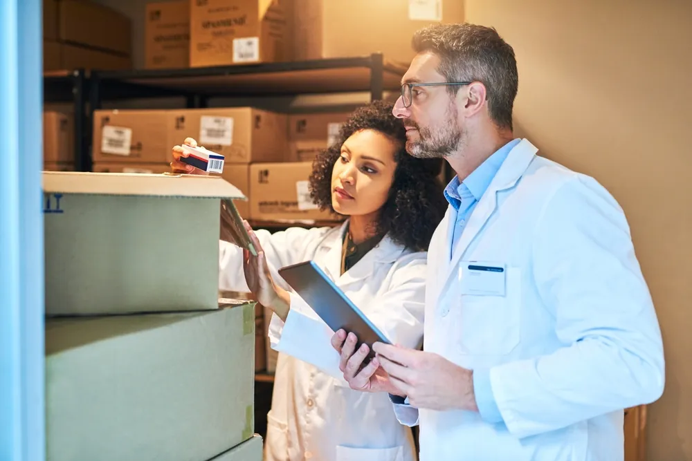 The History and Impact of Cold Chain Logistics doctors looking at parcel delivery of medications