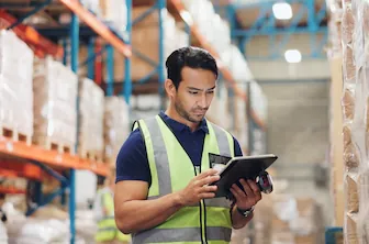 warehouse wellness worker on tablet