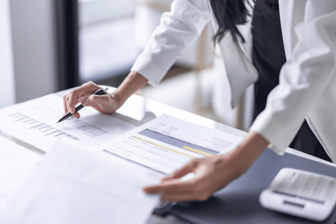 businesswoman-reading-through-data-