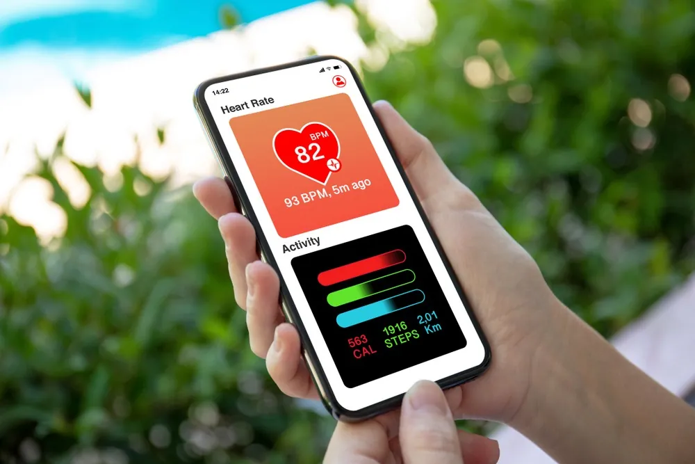 Trucker Tips For Healthier Living person holding phone checking health stats