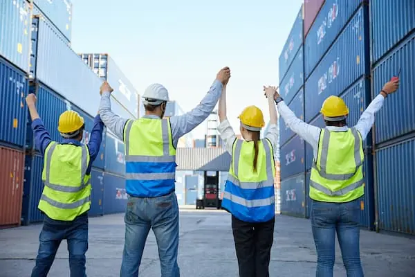 The Spring Break Effect group of port workers cheering