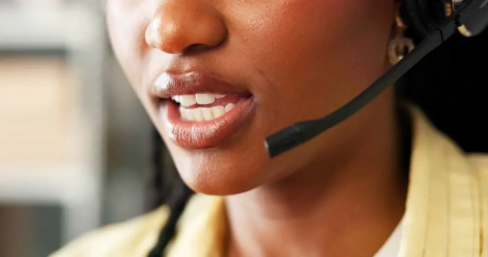 How to Communicate Better in Logistics woman broker talking on headset to client