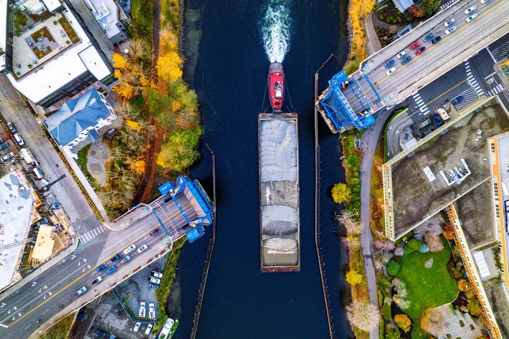 bird eye view of tugboat with barge