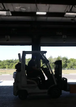 forklift driver inside a freight terminal