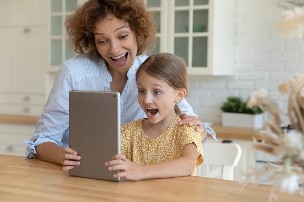 mom and daughter with tablet