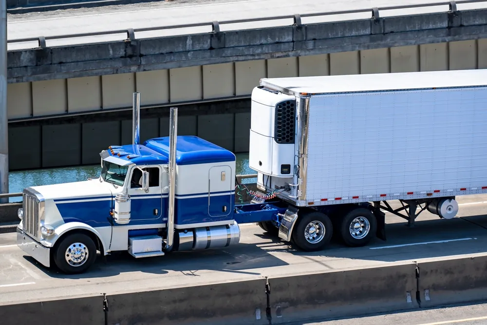 blue truck with reefer trailer