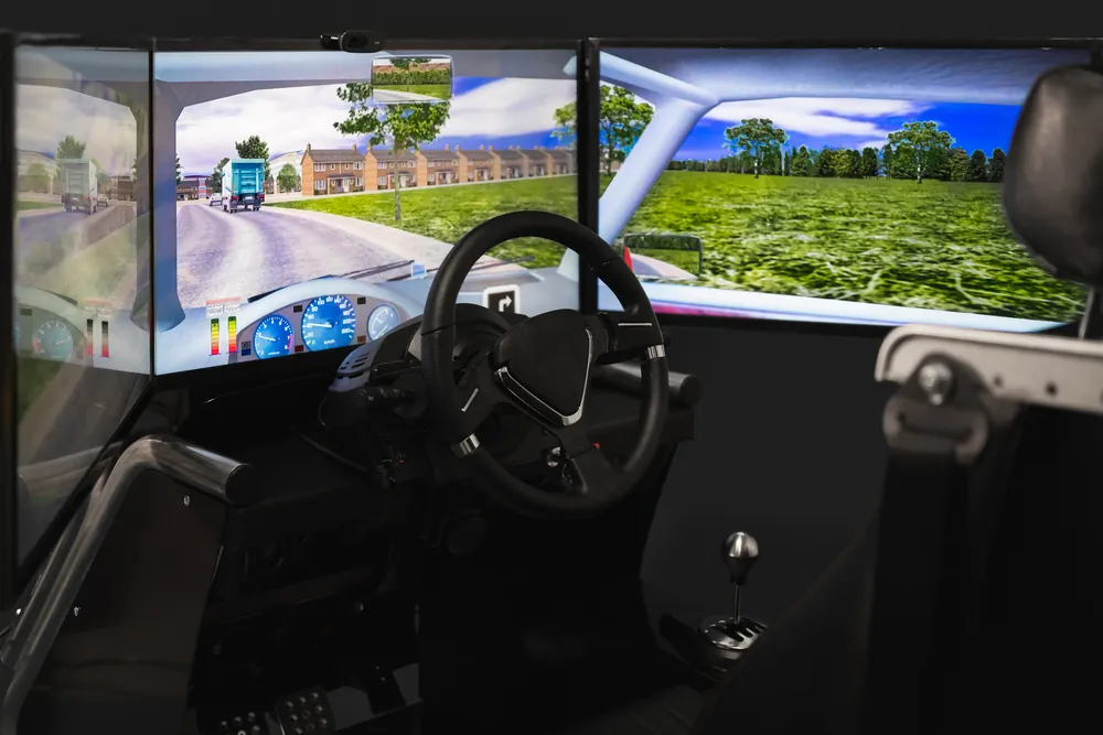 driving simulator on computer monitors with steering wheel