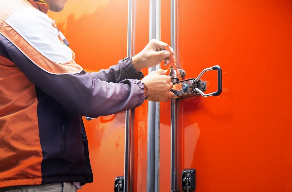 person locking up container
