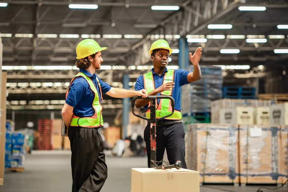 warehouse workers discussing inside
