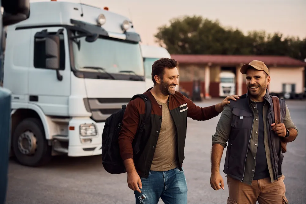 COMP two-truck-drivers-laughing-while-walking
