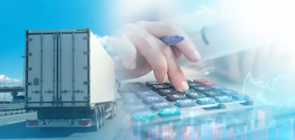 Harsh Reality of the Modern Freight Recession person calculating expenses on a calculator next to an image of a white semi trailer driving down a urban highway