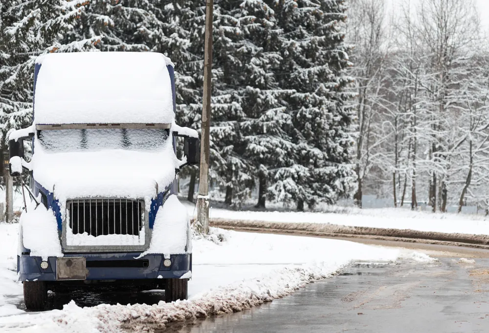 freight truck covered in snow and ice