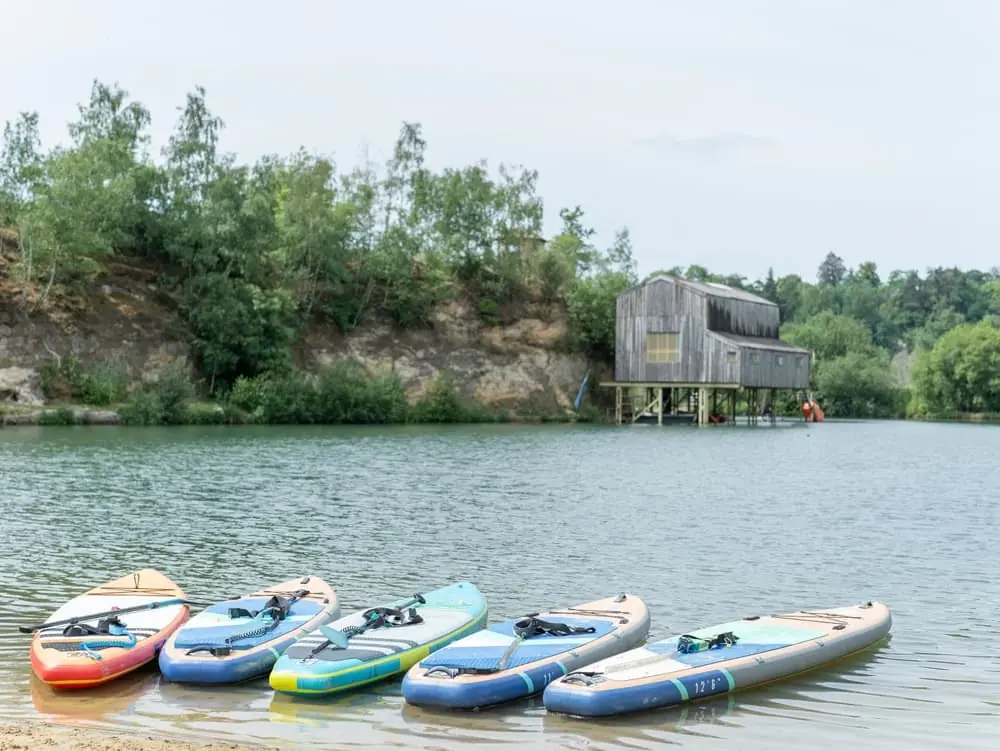Tranquil view of paddleboards at lake