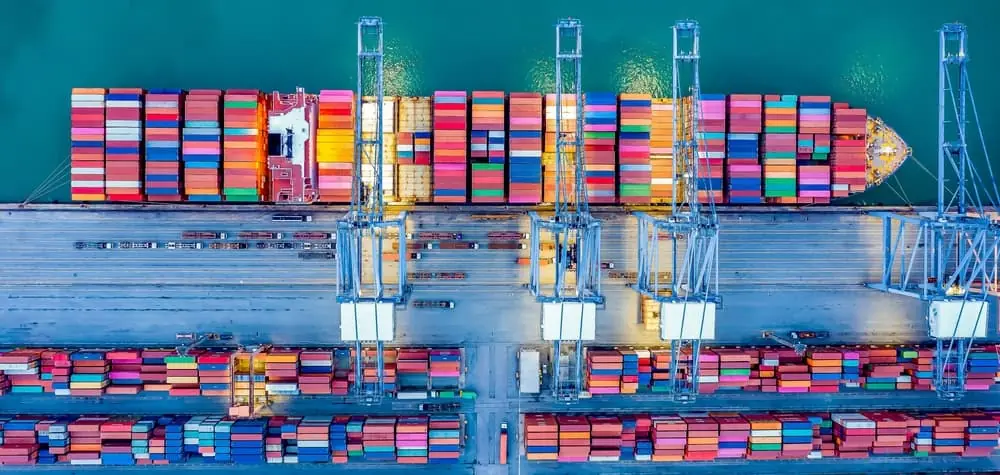 Freight Equipment Squeeze aerial view of a container ship being loaded at port