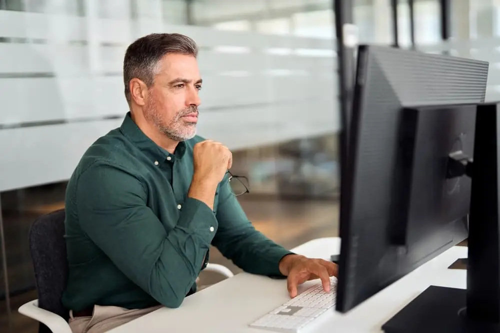 SKU-Level Risk Forecasting businessman studying data on his computer