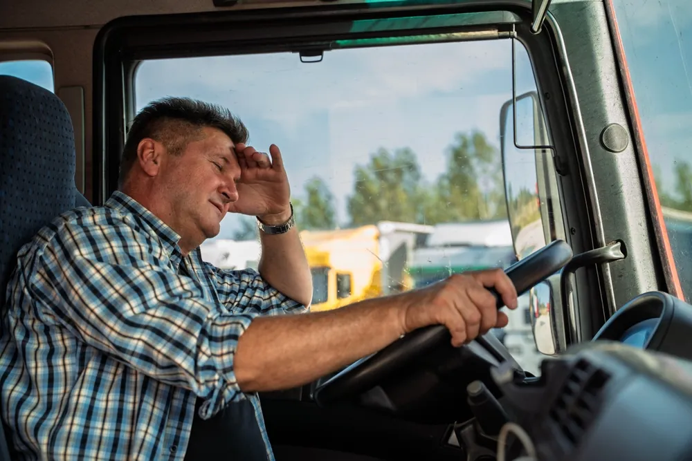 stressed looking driver behind the wheel