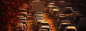 Truck Bottlenecks view of traffic jam at sunset